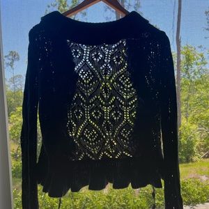 Cute black ruffled vintage cardigan 
Small rip is covered up on person w/ruffles